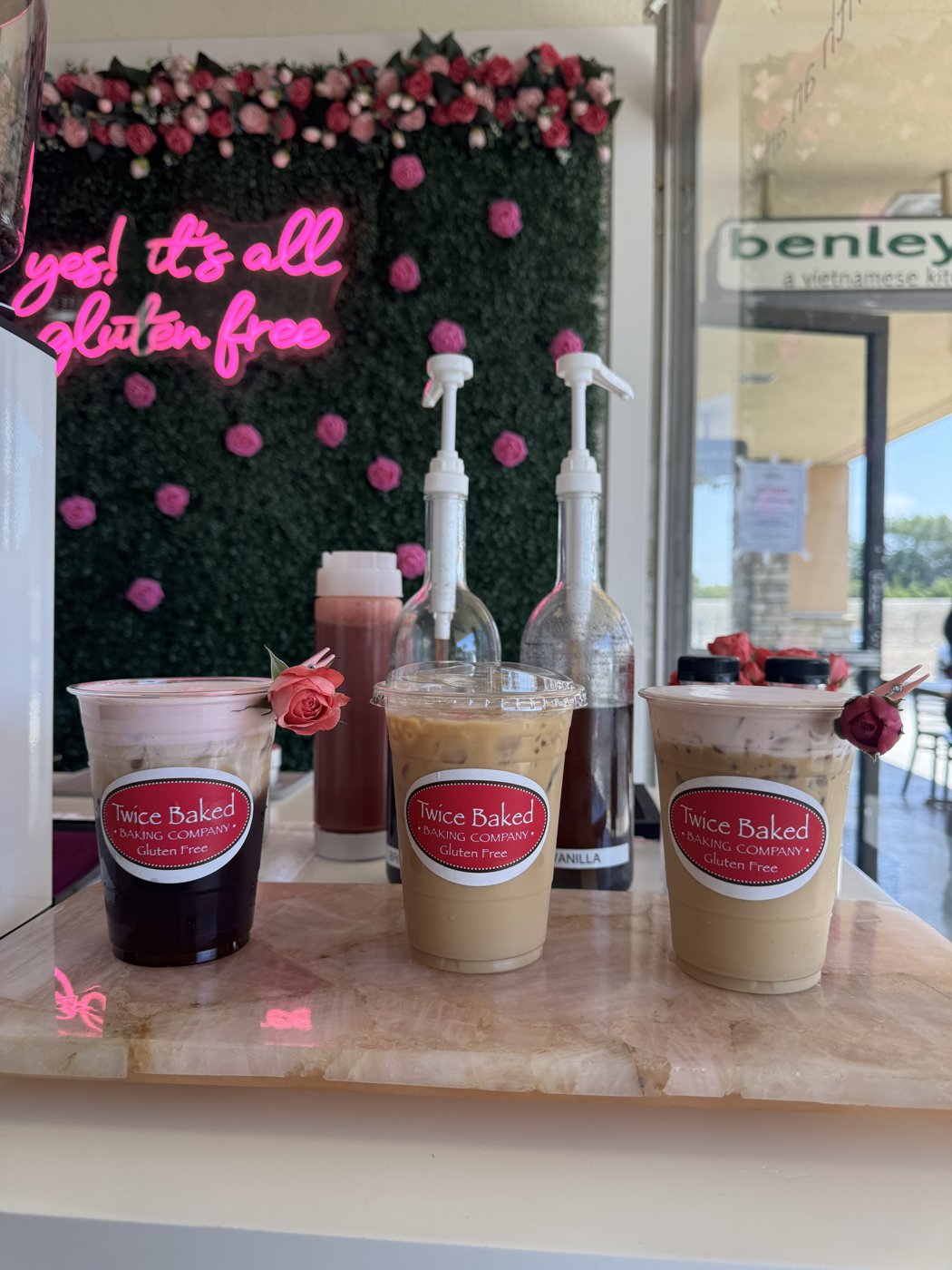 Three signature coffee drinks lined up at the service